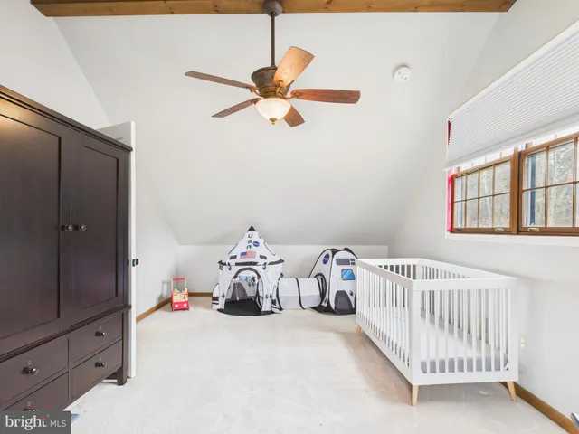 a view of a yard with snow on the road