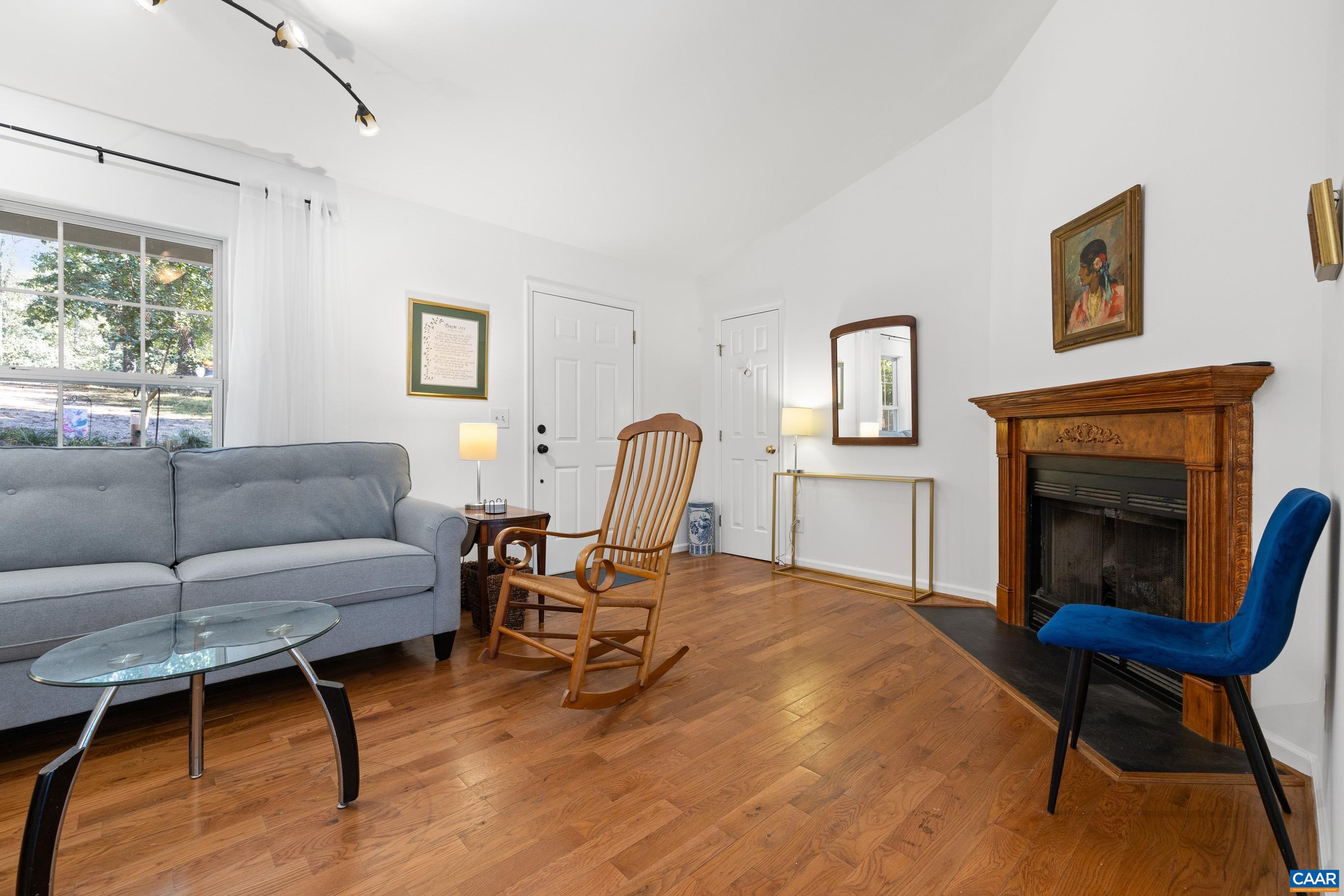 528 Jonquil Road Ruckersville, VA 22968 - Photo 29 of 66 a living room with furniture and a fireplace