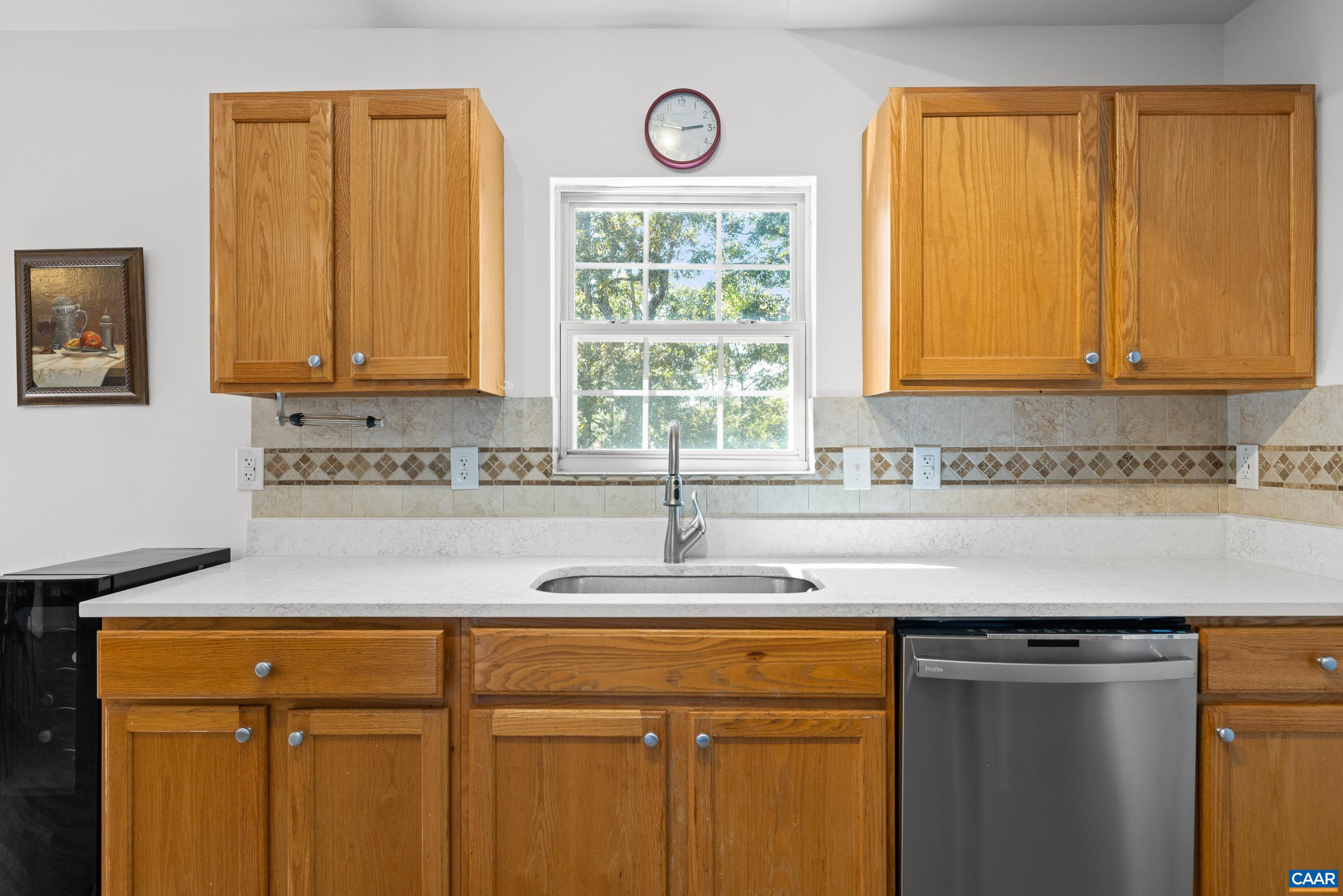 528 Jonquil Road Ruckersville, VA 22968 - Photo 35 of 66 a kitchen with stainless steel appliances granite countertop cabinets and a window
