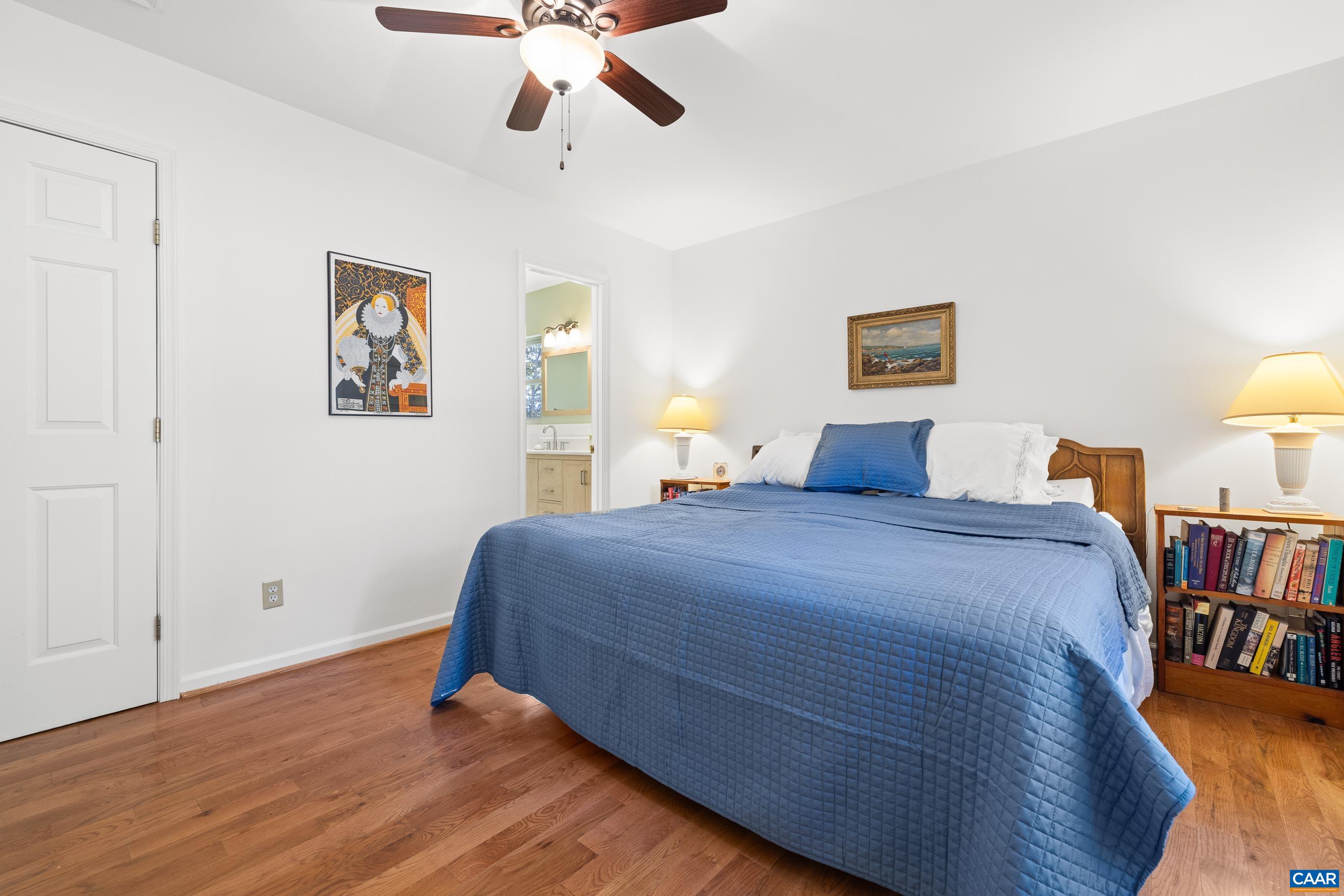 528 Jonquil Road Ruckersville, VA 22968 - Photo 41 of 66 a bedroom with a bed and wooden floor