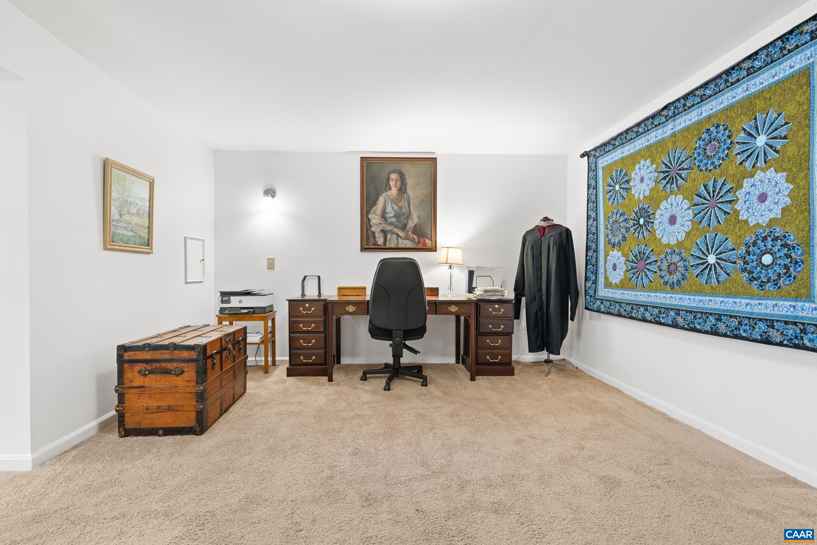 528 Jonquil Road Ruckersville, VA 22968 - Photo 50 of 66 a view of a workspace with furniture and a couch