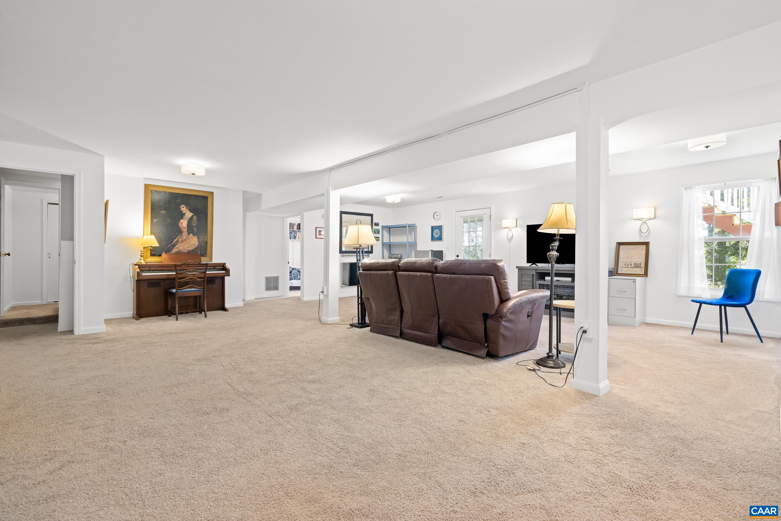 528 Jonquil Road Ruckersville, VA 22968 - Photo 51 of 66 a view of a livingroom with furniture and a flat screen tv