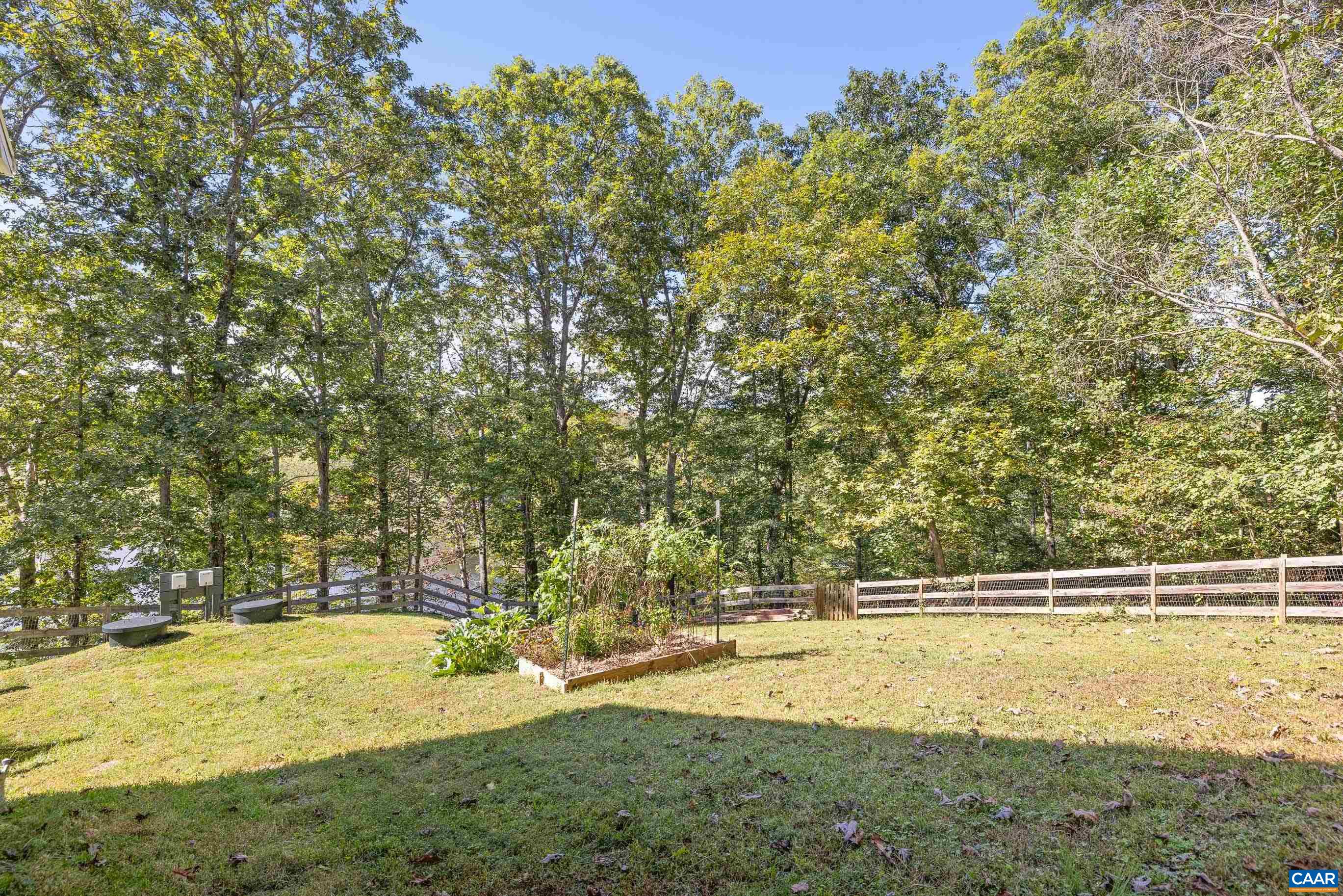 528 Jonquil Road Ruckersville, VA 22968 - Photo 8 of 66 a view of a swimming pool with an outdoor space and seating area