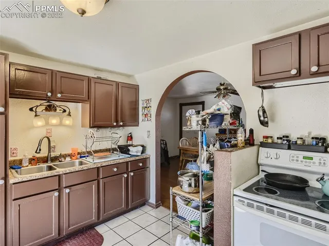 a kitchen with a stove and cabinets