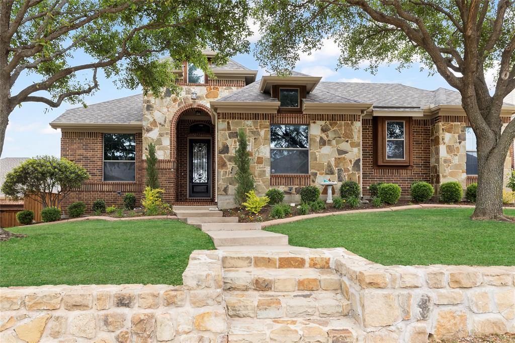 1709 Sterling Trace Drive Keller, TX 76248 - Photo 1 of 1 a front view of a house with garden