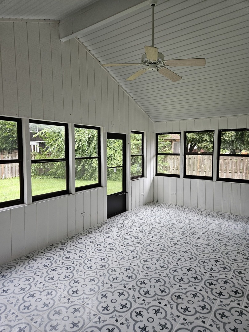 17612 Wright Street Lansing, IL 60438 - Photo 14 of 40 a bedroom with a large bed and a window