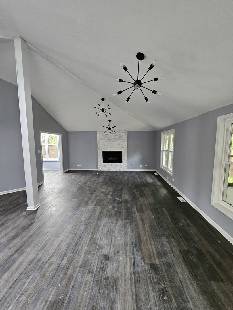 17612 Wright Street Lansing, IL 60438 - Photo 16 of 40 wooden floor in an empty room with a window