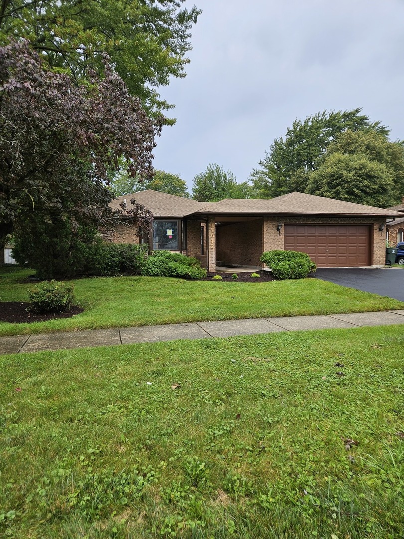 17612 Wright Street Lansing, IL 60438 - Photo 2 of 40 a front view of house with yard and green space