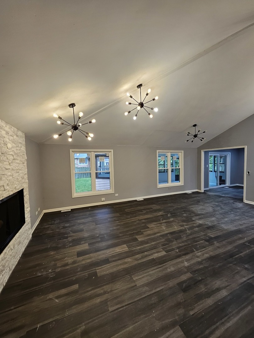 17612 Wright Street Lansing, IL 60438 - Photo 23 of 40 a view of livingroom with hardwood floor and ceiling fan