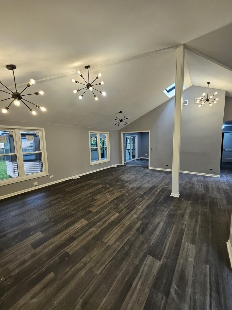 17612 Wright Street Lansing, IL 60438 - Photo 24 of 40 an empty room with wooden floor and windows