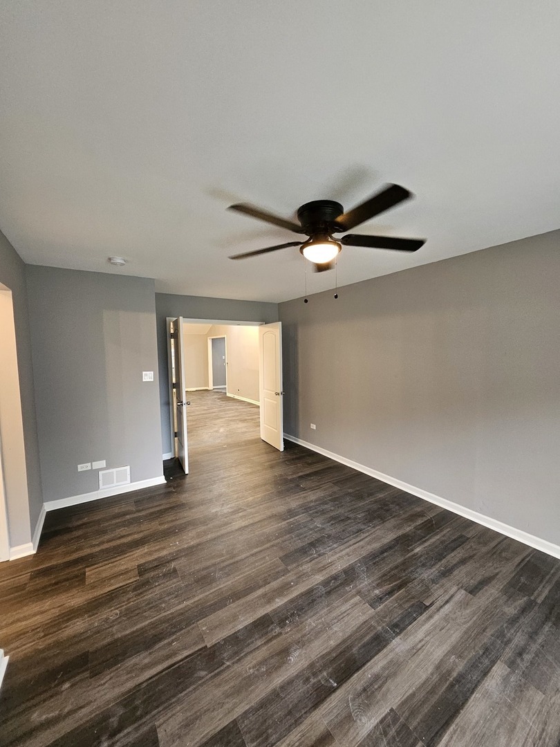 17612 Wright Street Lansing, IL 60438 - Photo 30 of 40 a view of empty room with wooden floor