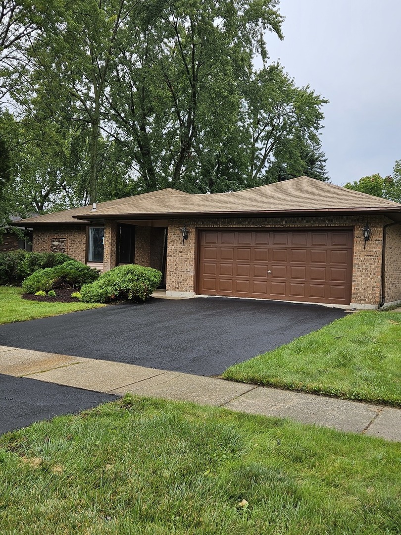 17612 Wright Street Lansing, IL 60438 - Photo 39 of 40 a front view of house with a garden