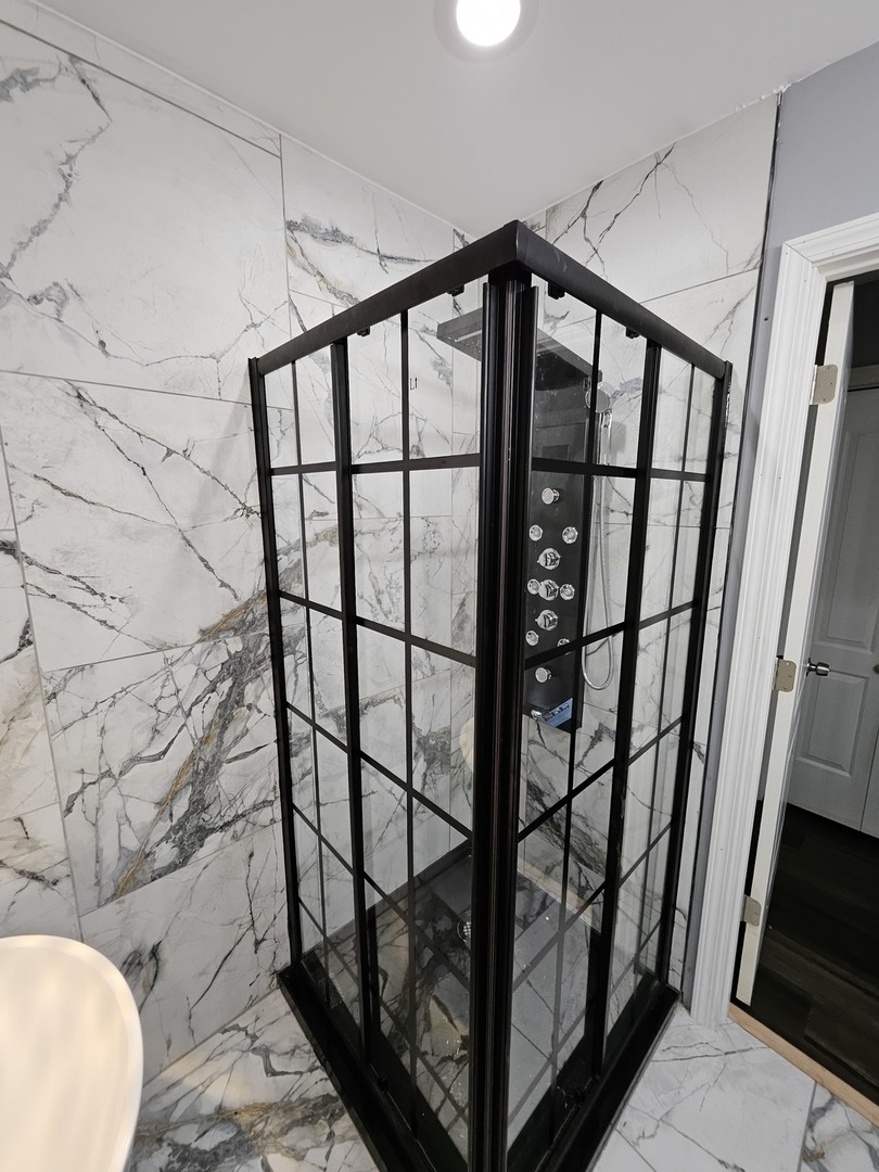 17612 Wright Street Lansing, IL 60438 - Photo 6 of 40 a bathroom with a toilet and a shower