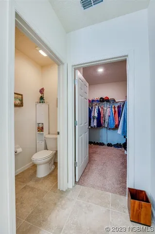 a bedroom with bed and a window