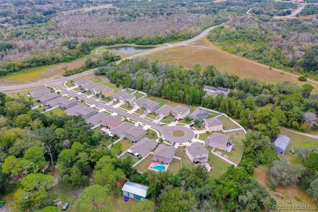 a view of a swimming pool and a yard