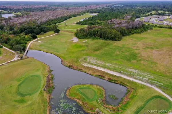 an aerial view of residential house with outdoor space and lake view