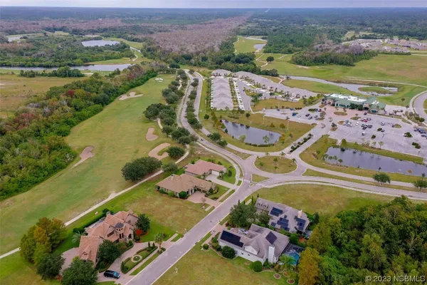 an aerial view of a swimming pool and outdoor space