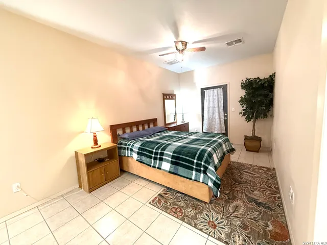 a bedroom with a bed and cabinets