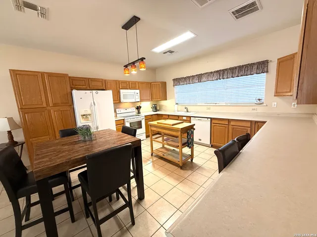 a view of a dining room with furniture