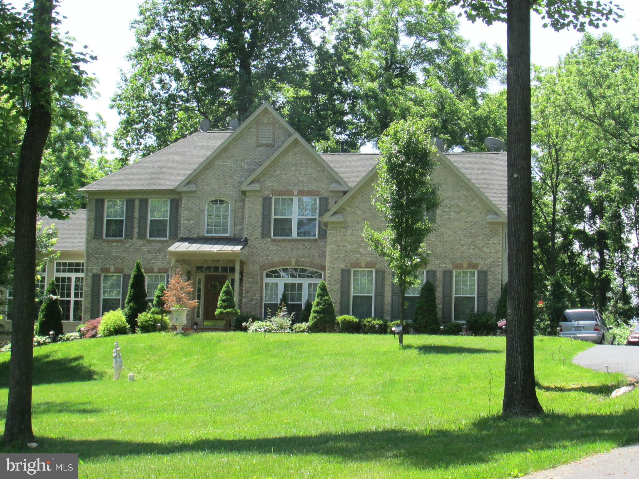 6660 South Clifton Road Frederick, MD 21703 - Photo 8 of 8 a front view of a house with a yard