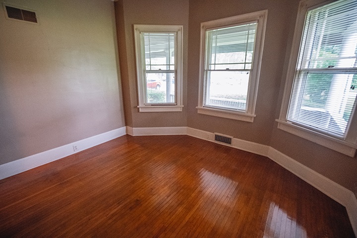 2829 Rice Avenue Rockford, IL 61101 - Photo 13 of 21 a view of an empty room with wooden floor and a window
