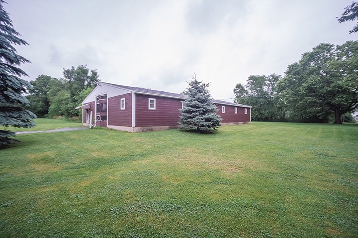 2829 Rice Avenue Rockford, IL 61101 - Photo 19 of 21 a view of a house with a big yard and large trees