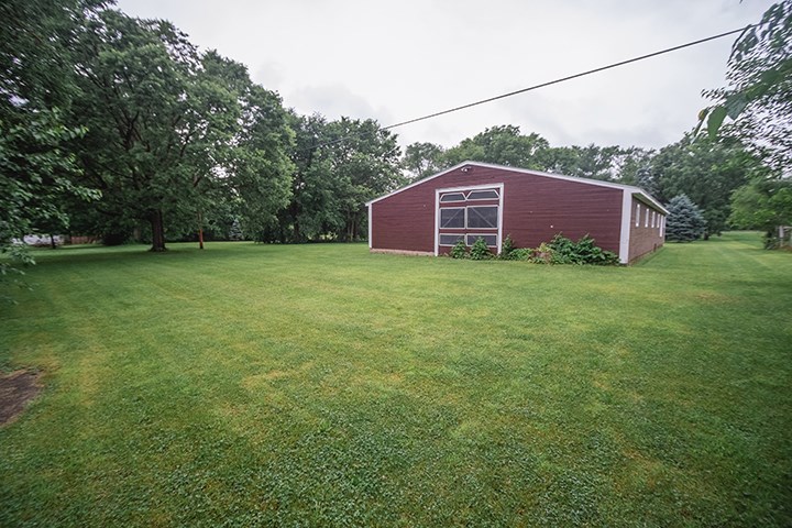 2829 Rice Avenue Rockford, IL 61101 - Photo 21 of 21 a view of a backyard with large trees