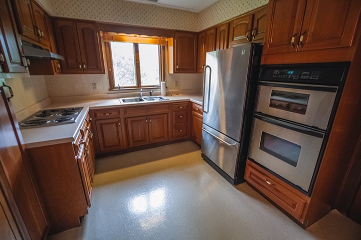 2829 Rice Avenue Rockford, IL 61101 - Photo 8 of 21 a kitchen with stainless steel appliances granite countertop a refrigerator a stove a sink and a microwave