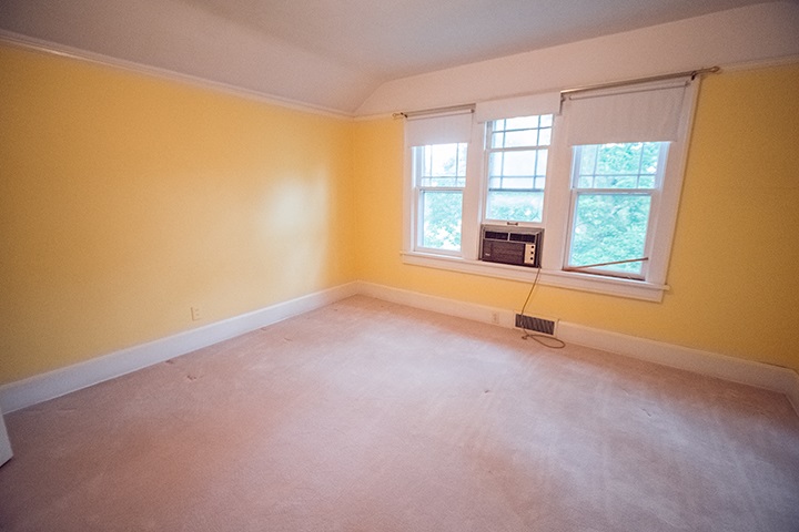 2829 Rice Avenue Rockford, IL 61101 - Photo 9 of 21 an empty room with a fireplace and large windows