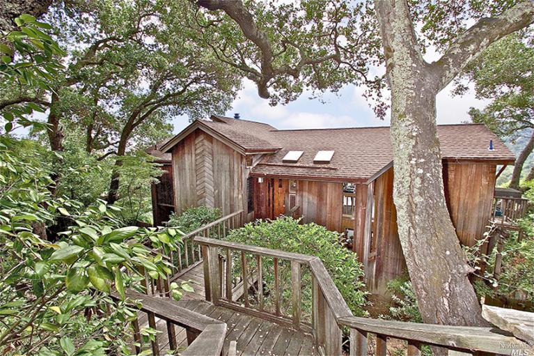 39 Ridge Road Fairfax, CA 94930 - Photo 1 of 1 a view of a house with large tree and wooden fence