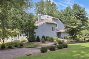 2 Raafenberg Road Sleepy Hollow, NY 10591 - Photo 1 of 1 a view of a white house with a yard and plants