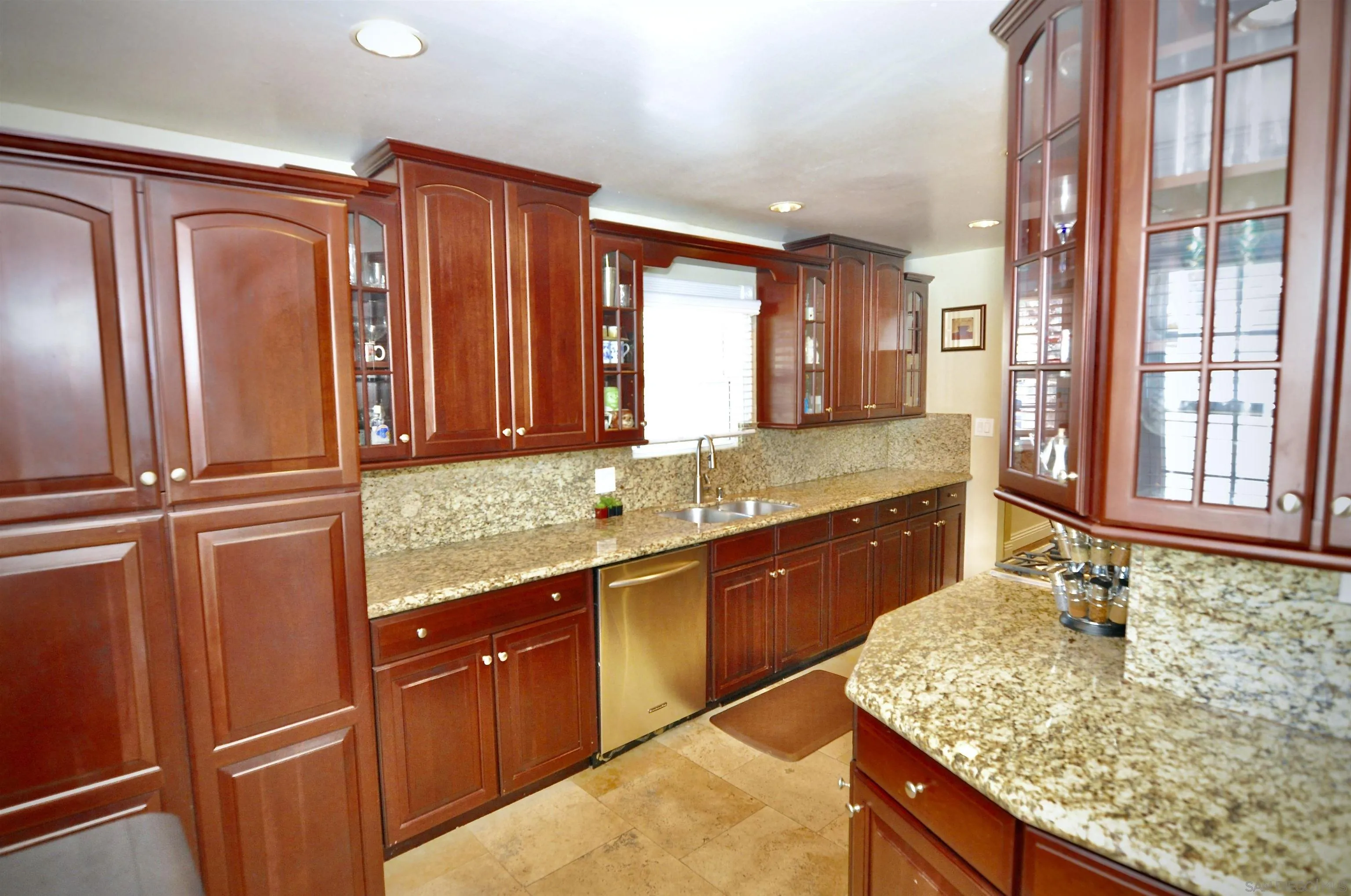 13328 Frame Road Poway, CA 92064 - Photo 17 of 29 a bathroom with a granite countertop sink and a large mirror