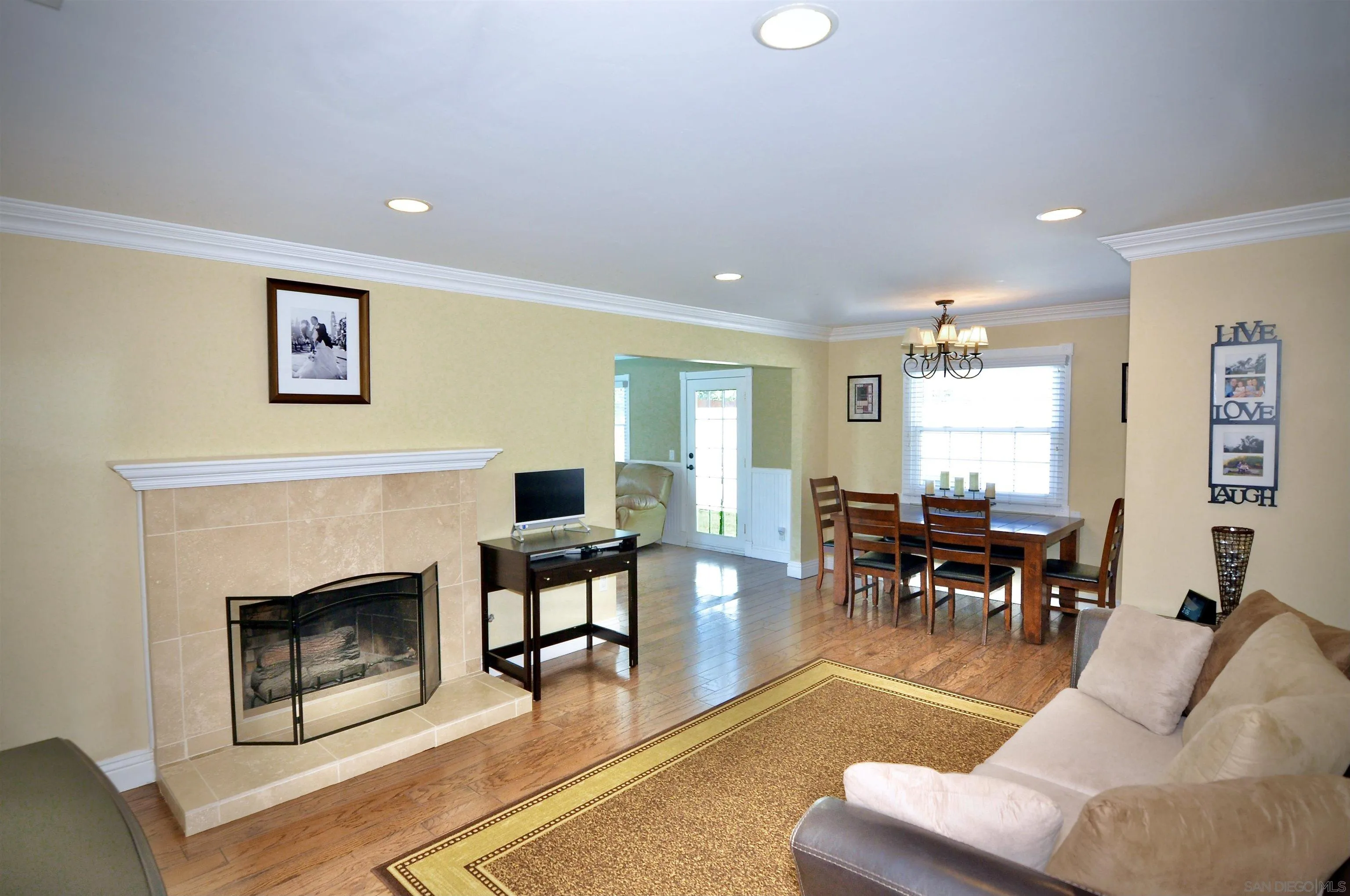 13328 Frame Road Poway, CA 92064 - Photo 3 of 29 a living room with furniture a rug and a fireplace