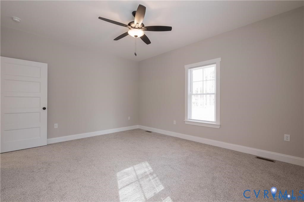 2223 Ridge Road Arvonia, VA 23004 - Photo 21 of 32 Carpeted room featuring a five-panel interior door