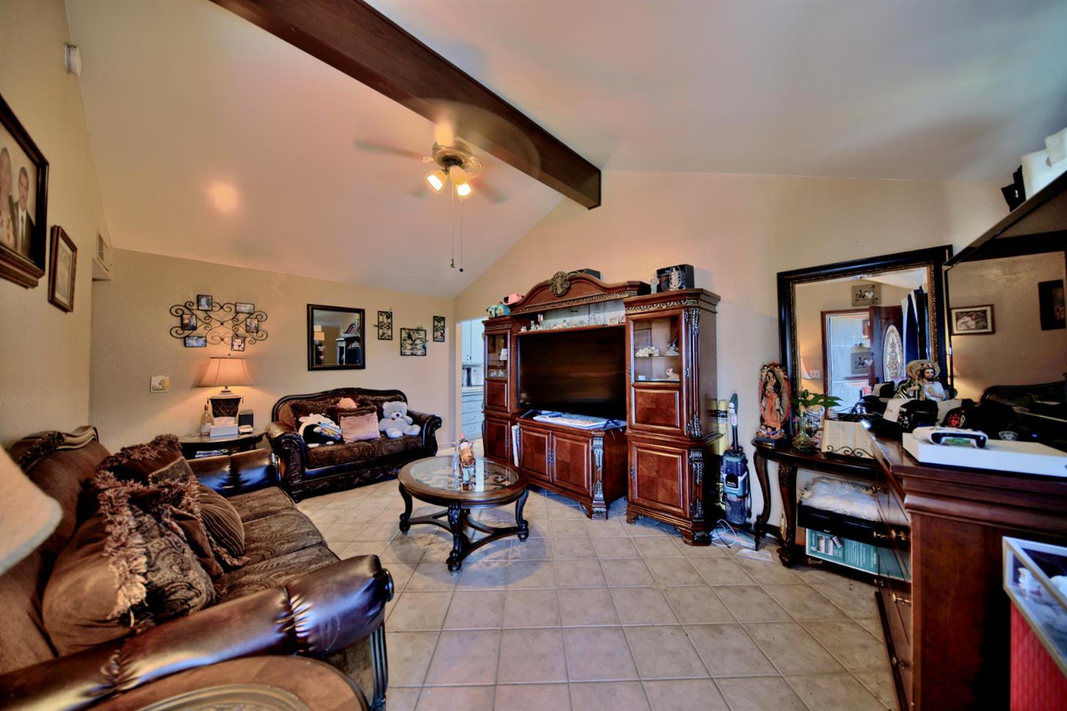 2013 Robertson Road Modesto, CA 95351 - Photo 3 of 24 a living room with furniture and a flat screen tv