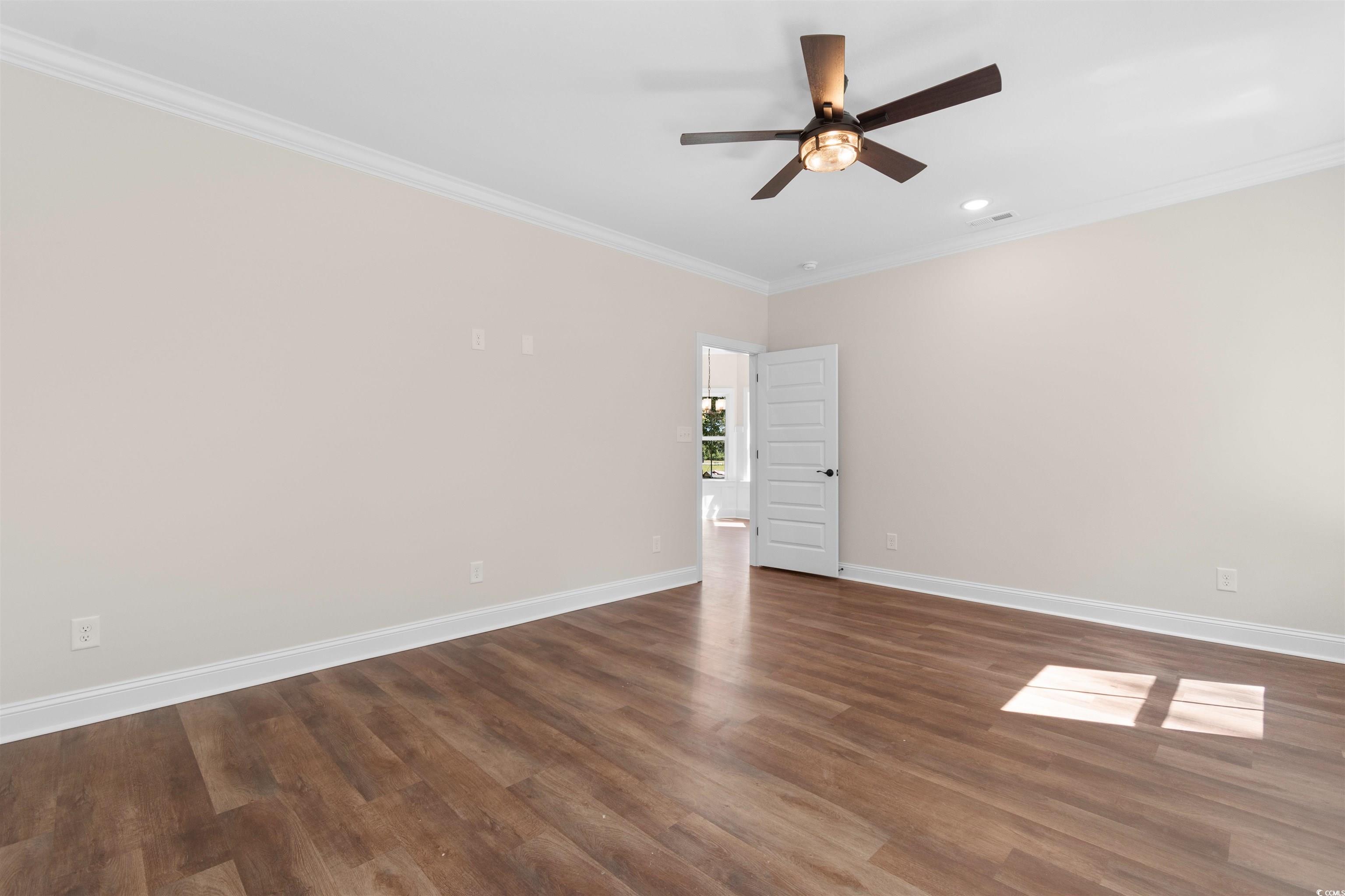 146 Temple Drive Aynor, SC 29511 - Photo 13 of 40 Unfurnished room featuring ornamental molding, dark wood finished floors, a ceiling fan, and recessed lighting