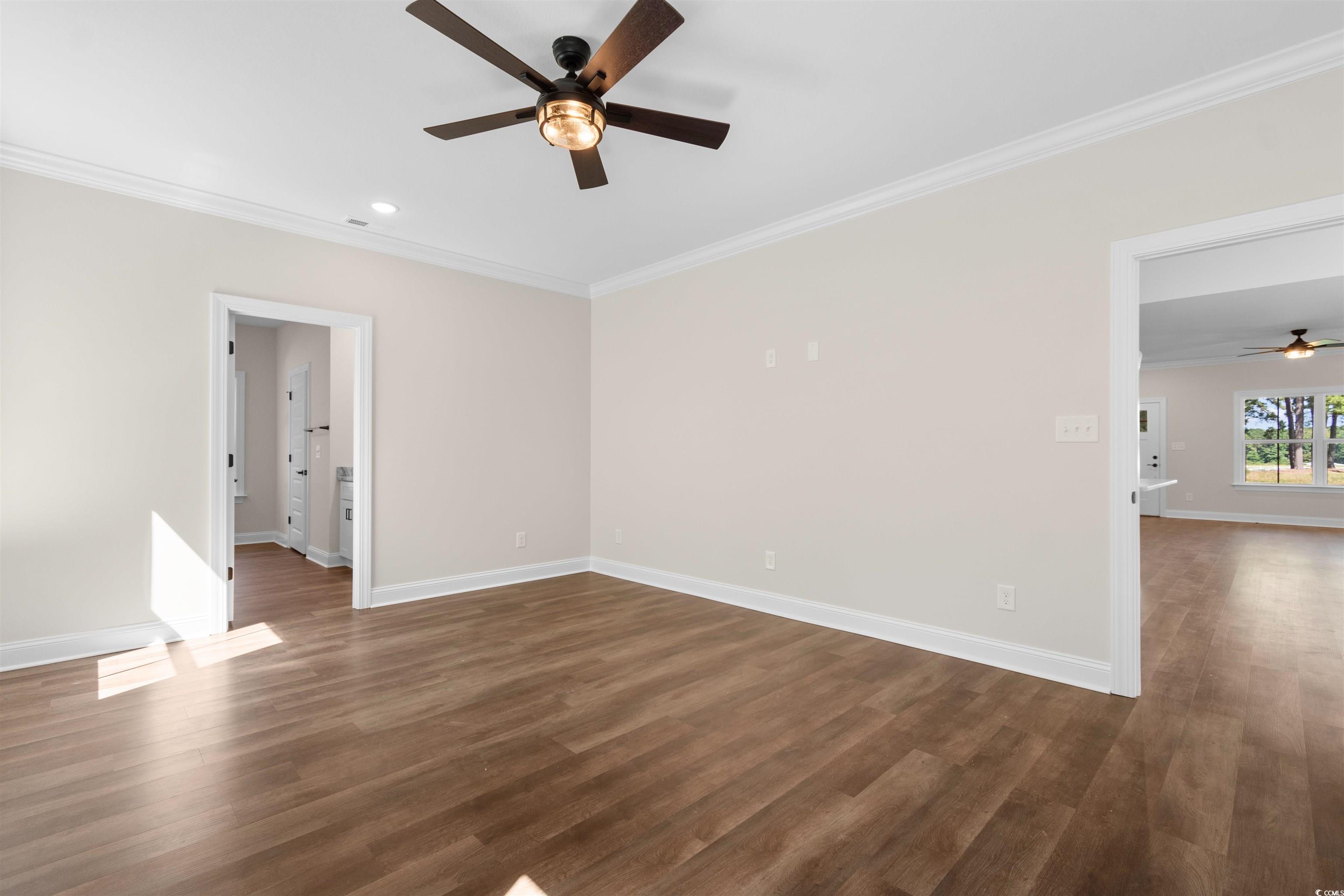 146 Temple Drive Aynor, SC 29511 - Photo 14 of 40 Unfurnished room with a ceiling fan, ornamental molding, dark wood-style flooring, and recessed lighting