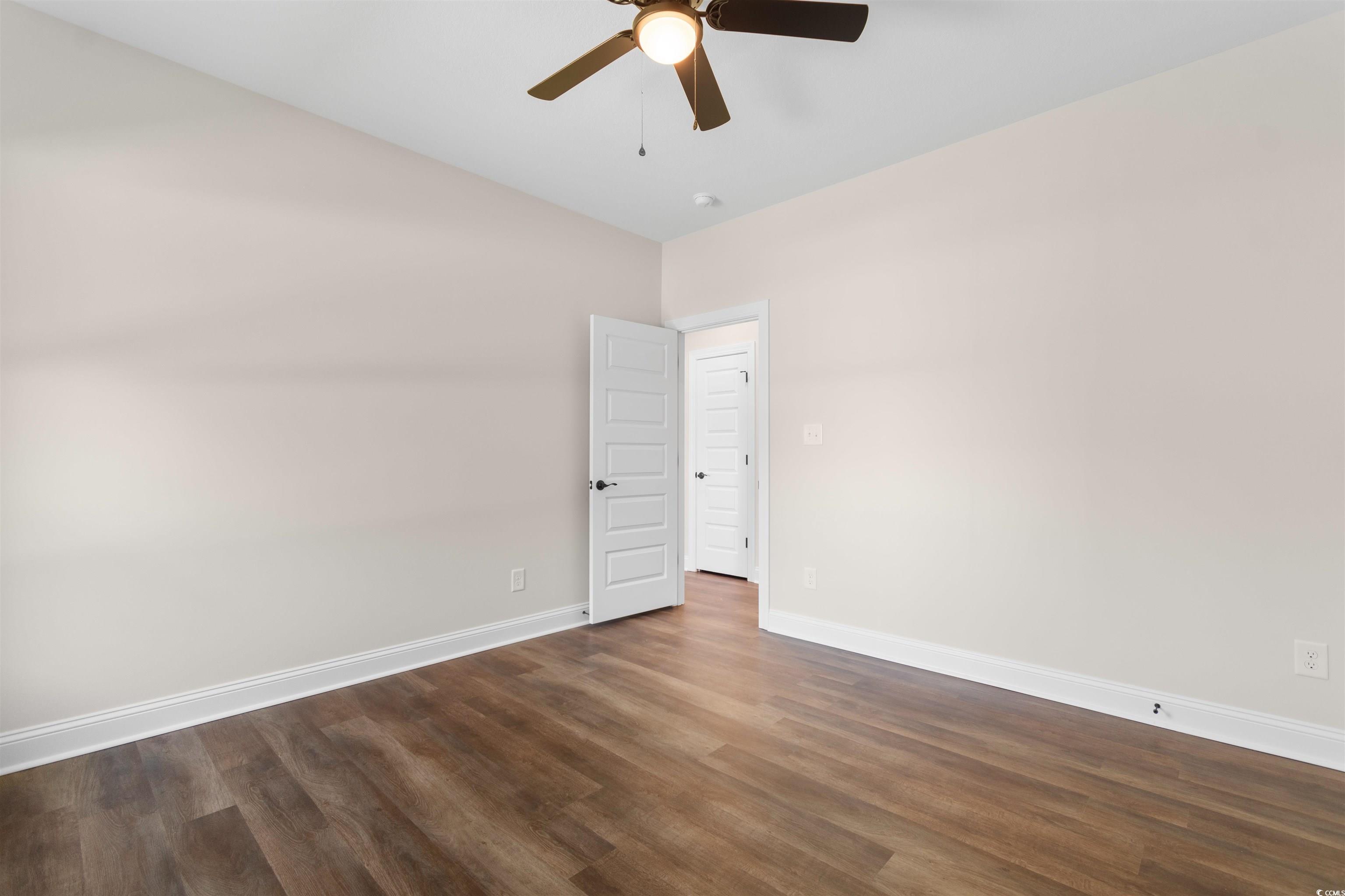 146 Temple Drive Aynor, SC 29511 - Photo 23 of 40 Empty room featuring dark wood finished floors and a ceiling fan
