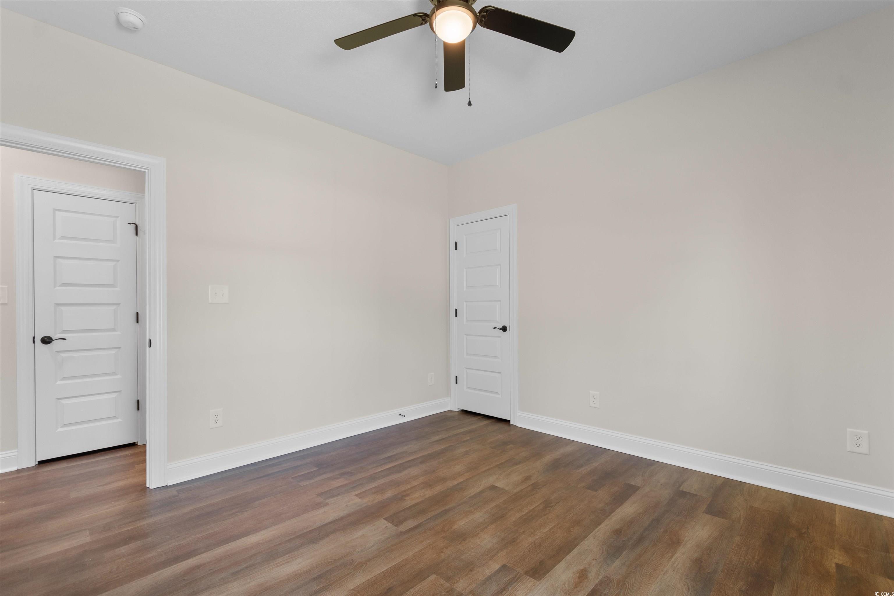 146 Temple Drive Aynor, SC 29511 - Photo 24 of 40 Spare room featuring dark wood-type flooring and a ceiling fan