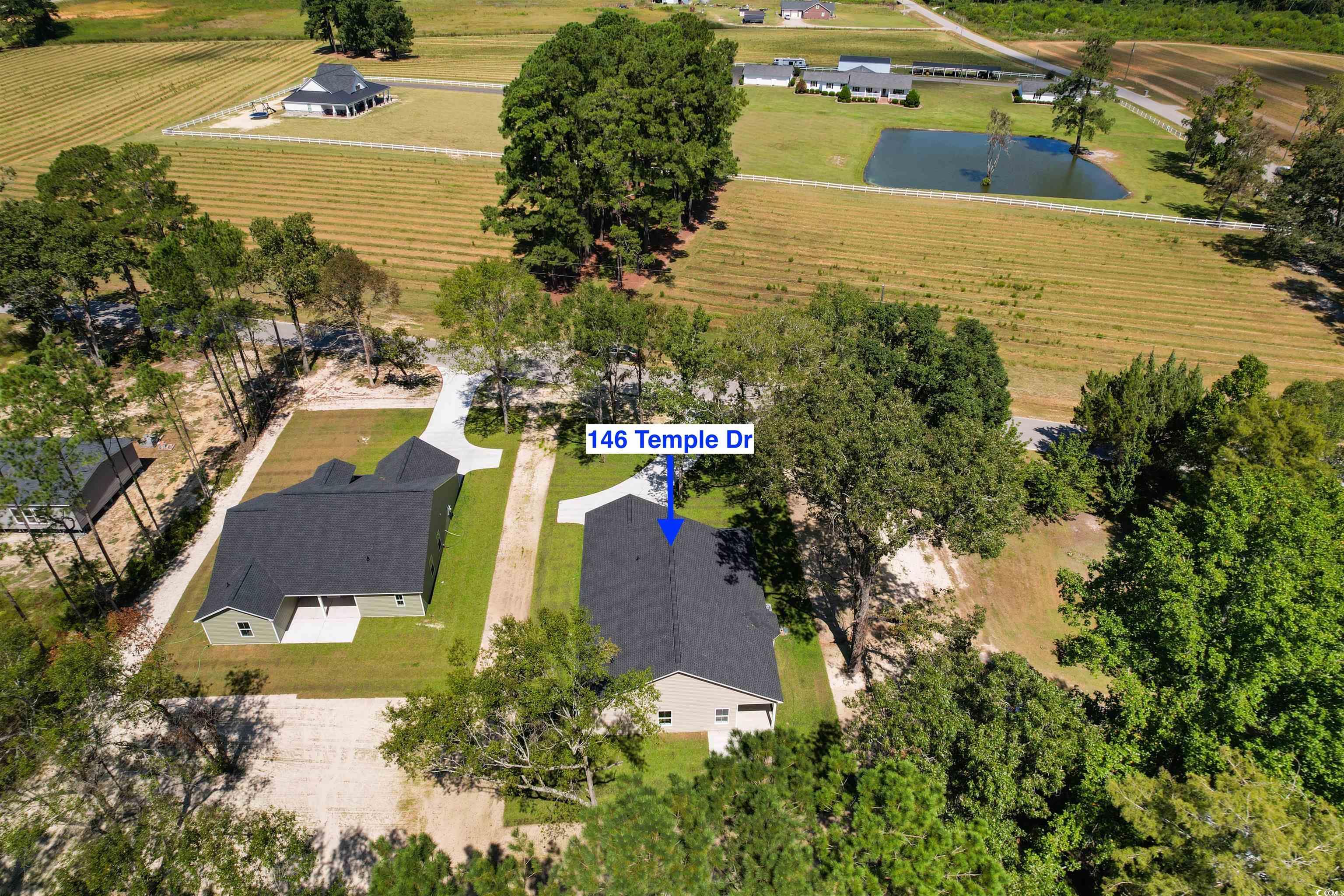 146 Temple Drive Aynor, SC 29511 - Photo 37 of 40 Aerial view of sparsely populated area featuring a large body of water and abundant farmland