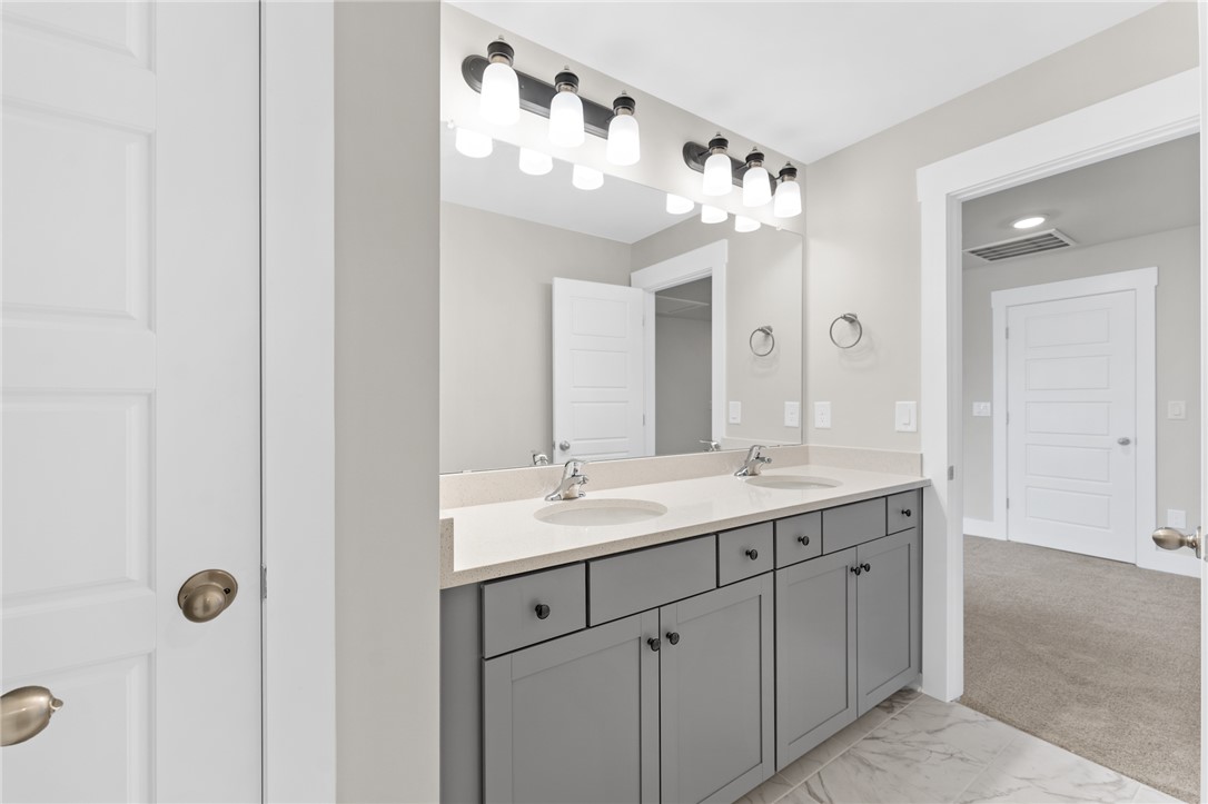 167 Tiger Lily Drive Anderson, SC 29621 - Photo 29 of 34 Dual vanity with ample storage and modern lighting creates a refreshing bathroom space.