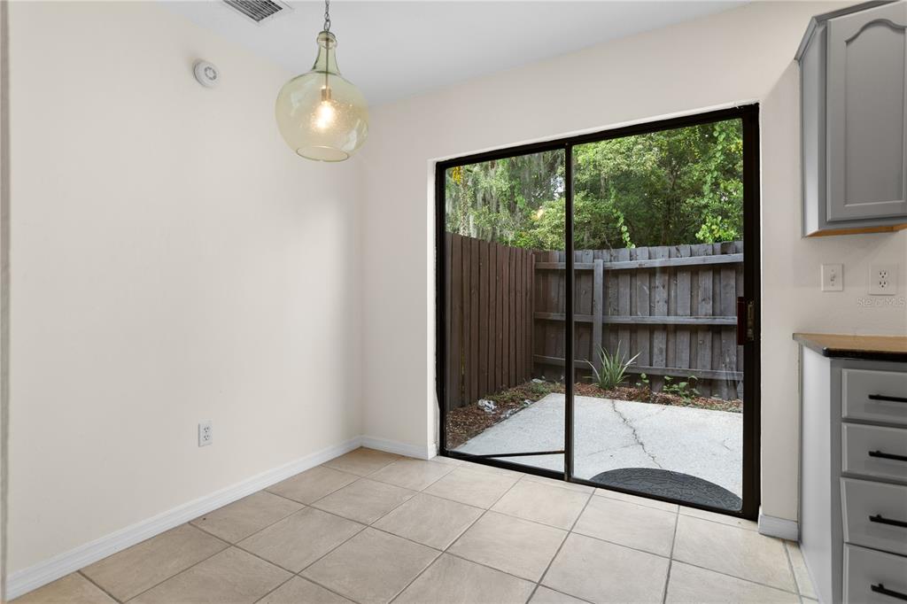 7337 Cedar Creek Court, Unit 75 Winter Park, FL 32792 - Photo 11 of 26 a view of a room with sliding glass door and glass door