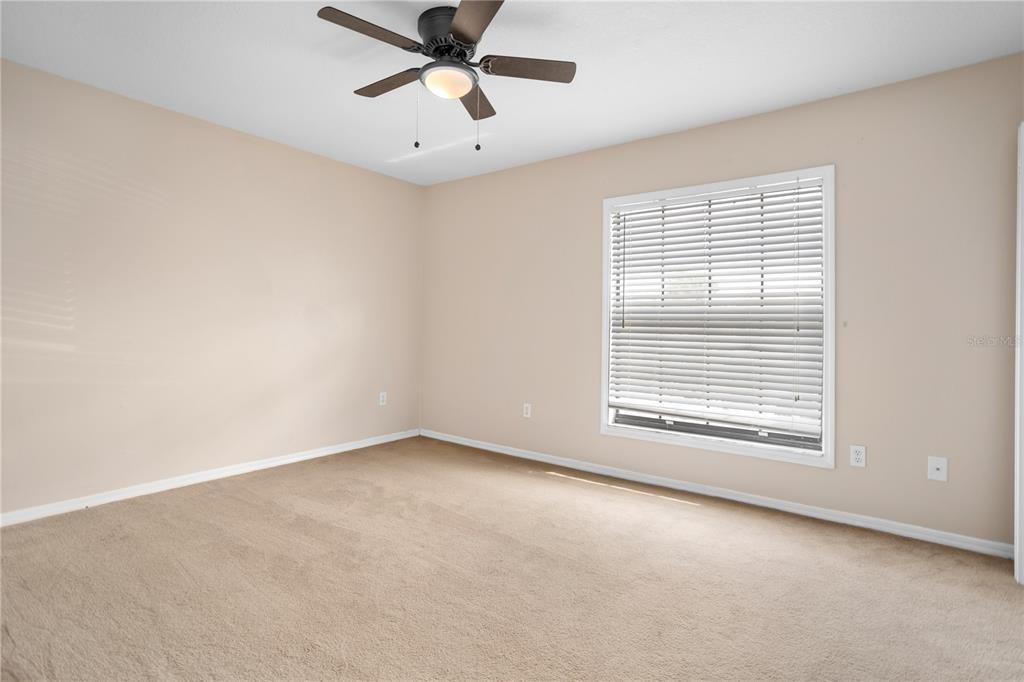 7337 Cedar Creek Court, Unit 75 Winter Park, FL 32792 - Photo 17 of 26 an empty room with a window and a fan