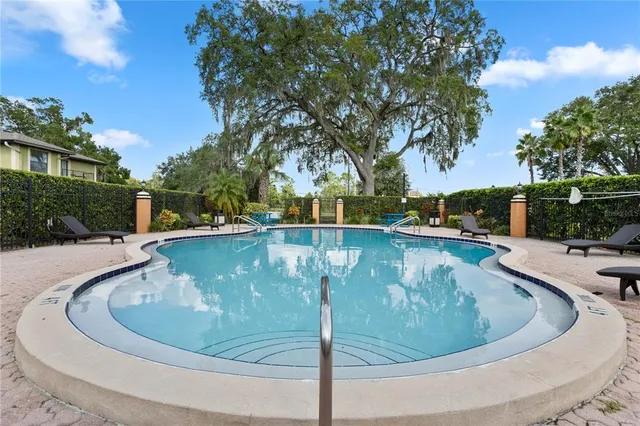 a view of a swimming pool with a patio