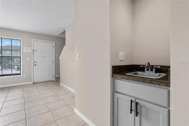 a kitchen with a sink and cabinets