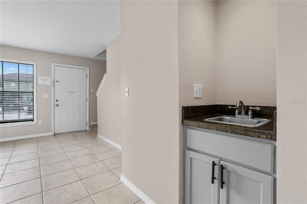 7337 Cedar Creek Court, Unit 75 Winter Park, FL 32792 - Photo 9 of 26 a kitchen with a sink and cabinets