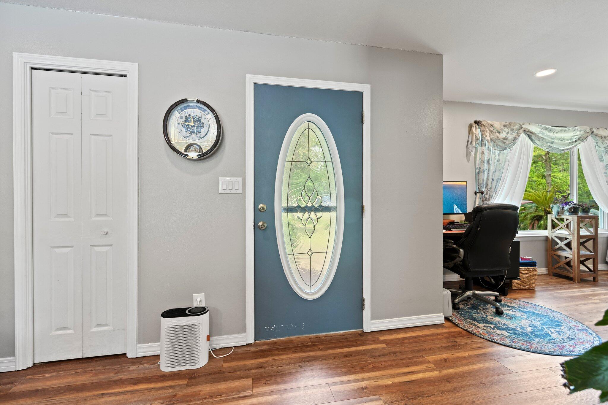 1120 Tallokas Road Crestview, FL 32536 - Photo 14 of 55 a view of a hallway with wooden floor and a workspace