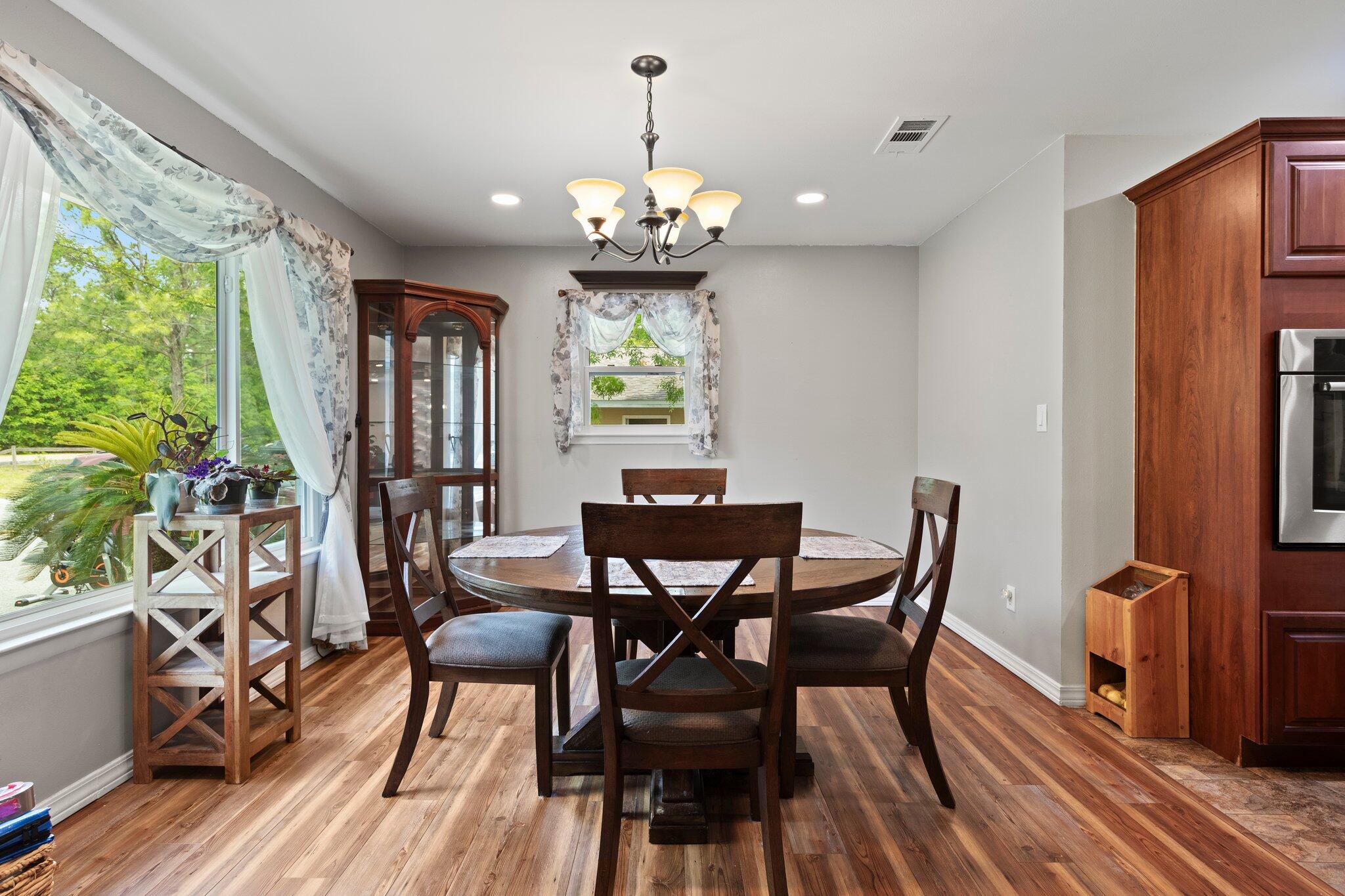 1120 Tallokas Road Crestview, FL 32536 - Photo 16 of 55 a view of a dining room with furniture window and outside view