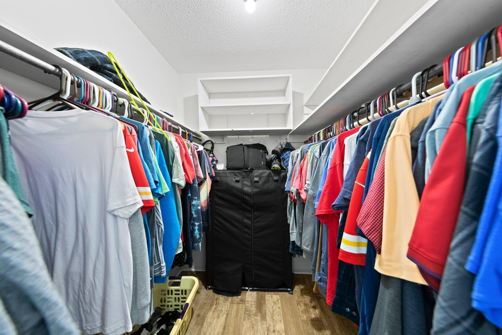 1120 Tallokas Road Crestview, FL 32536 - Photo 24 of 55 a view of walk in closet with clothes and shoes