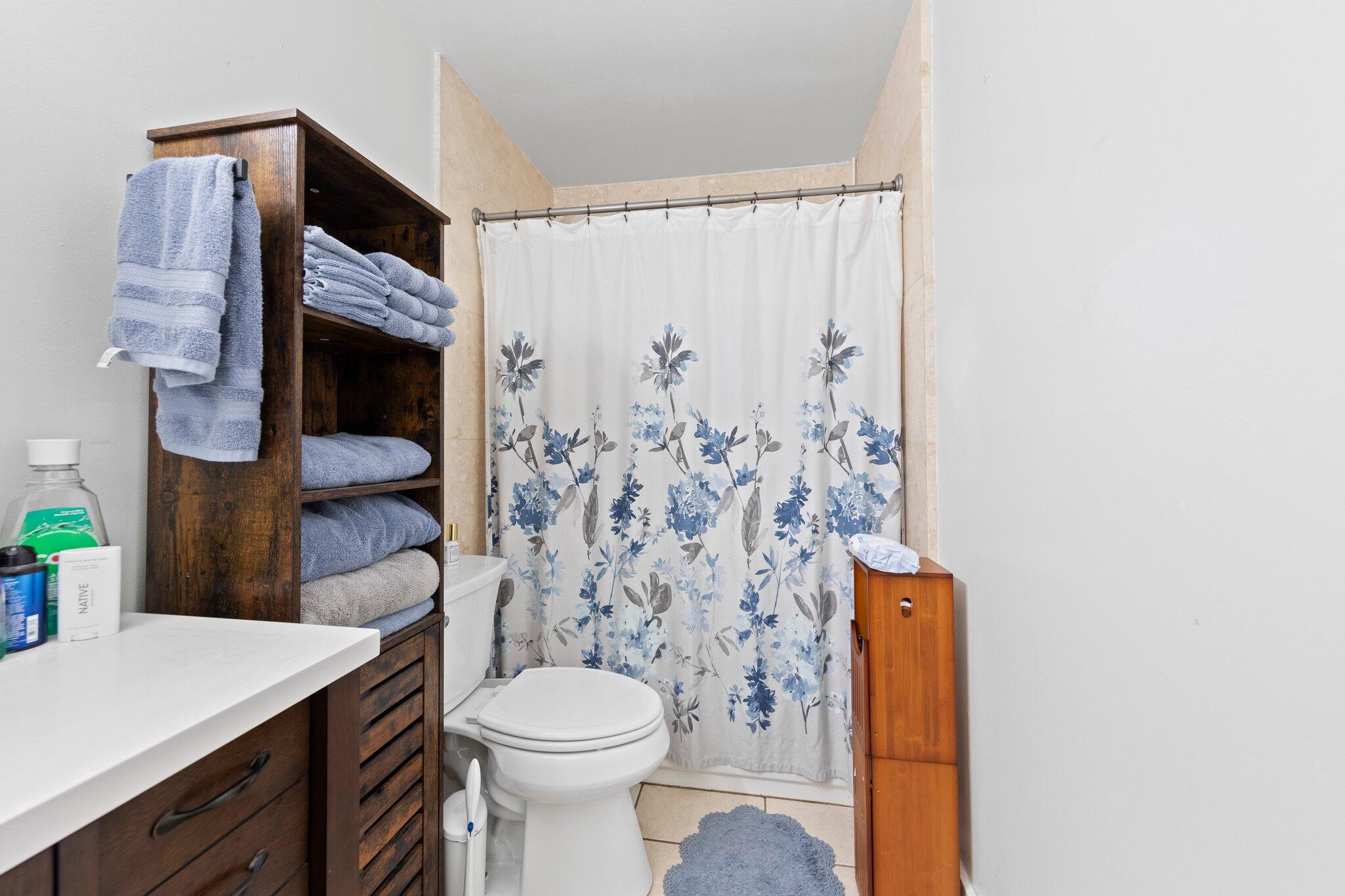 1120 Tallokas Road Crestview, FL 32536 - Photo 26 of 55 a bathroom with a toilet sink and shower curtain